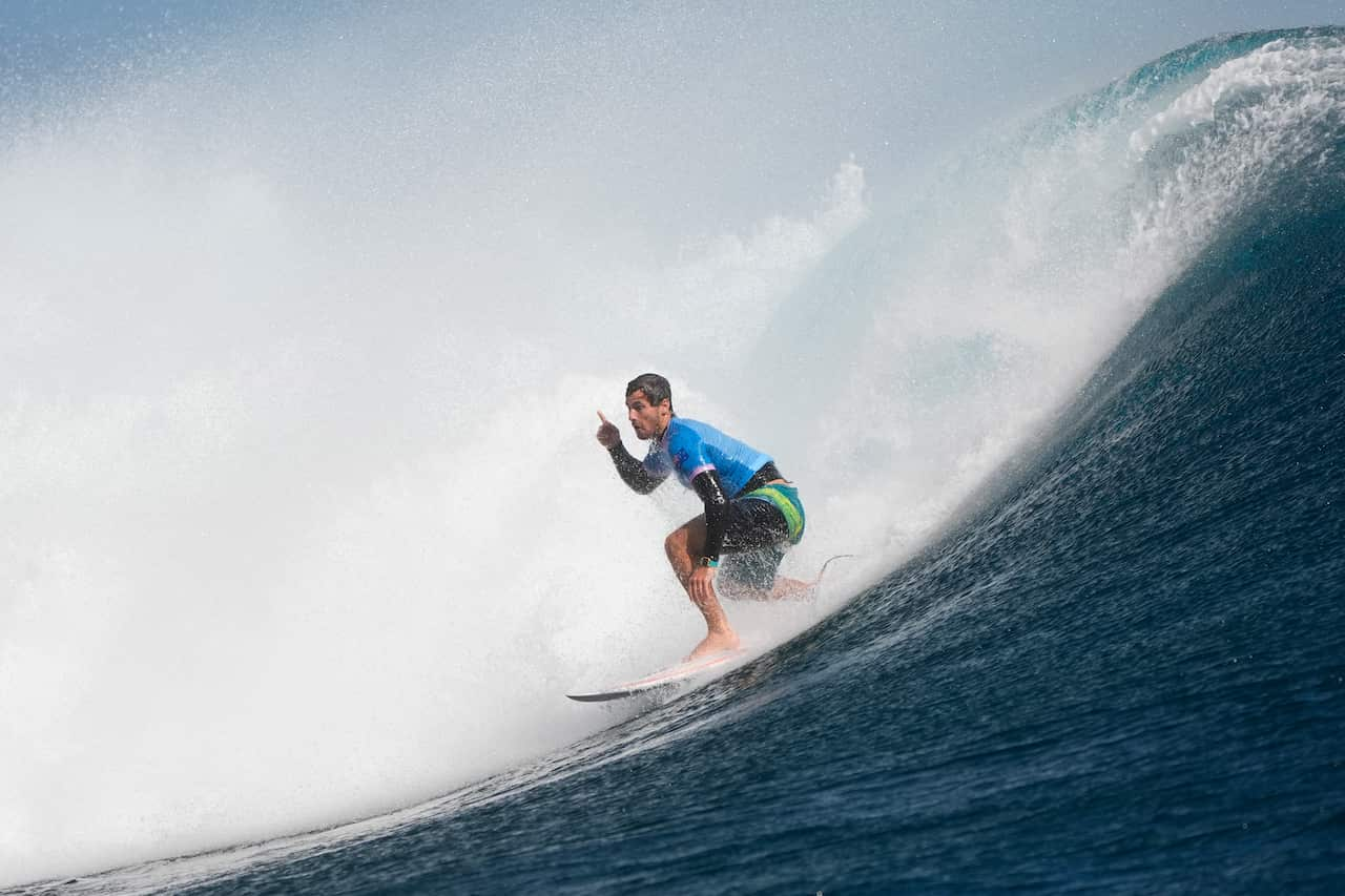 A surfer riding a big wave