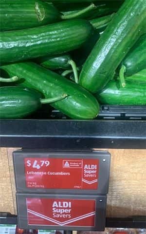 Cucumbers at a supermarket with a red Aldi super savers price tag