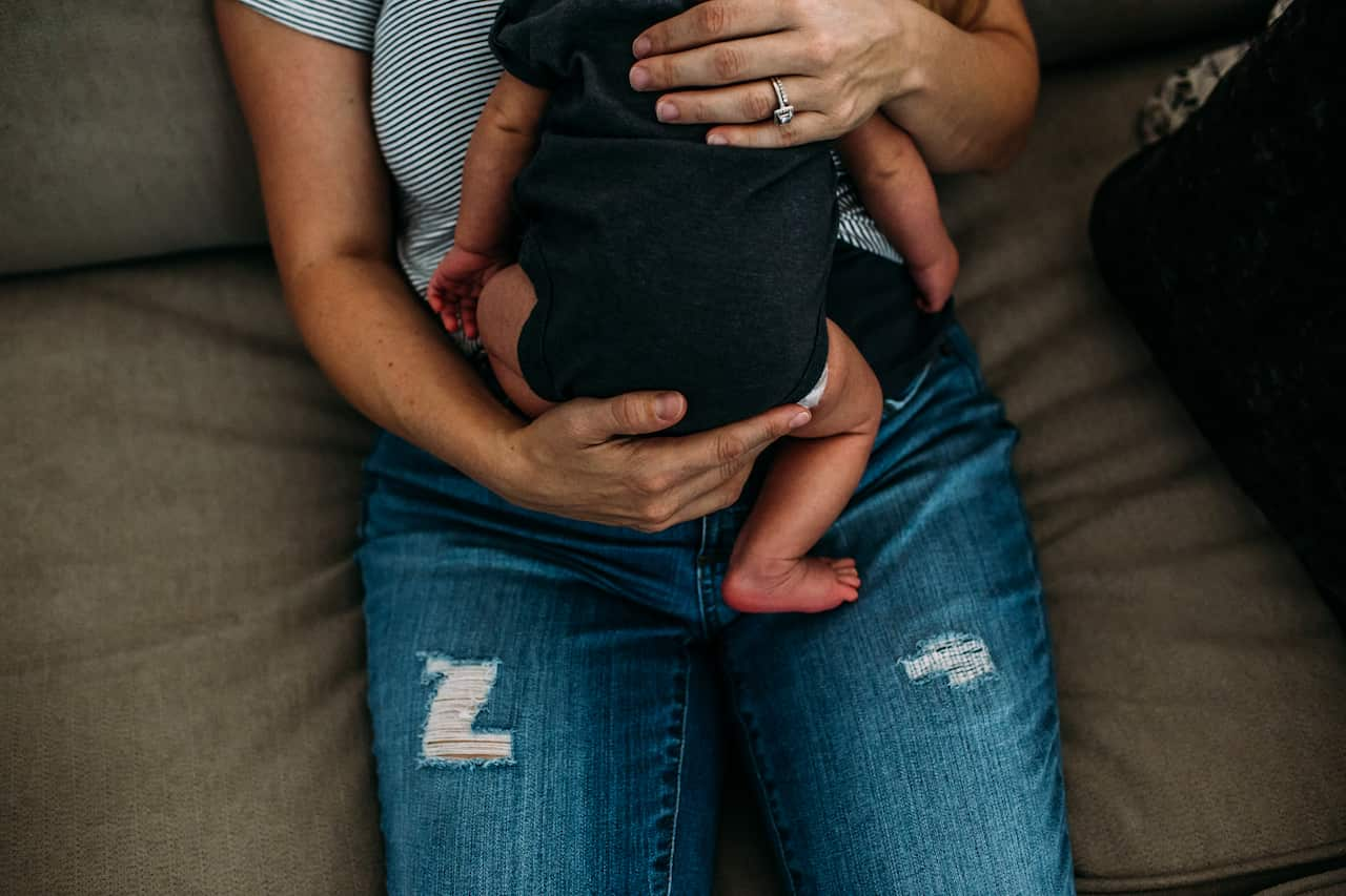 Overhead shot of woman holding a newborn baby