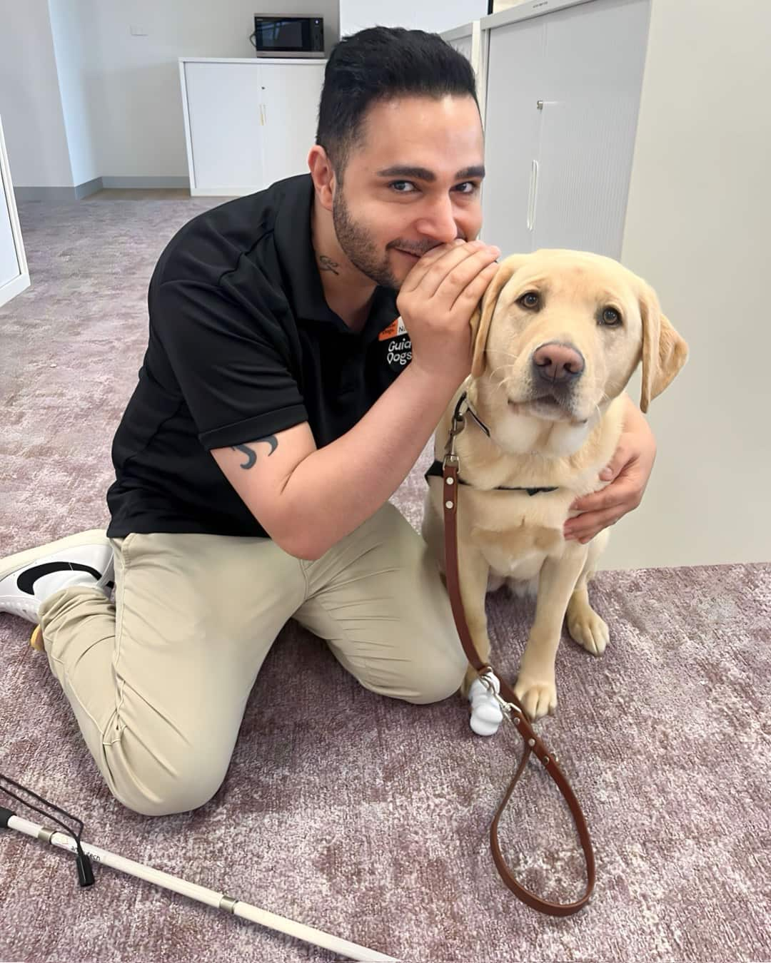 a man with a guide dog