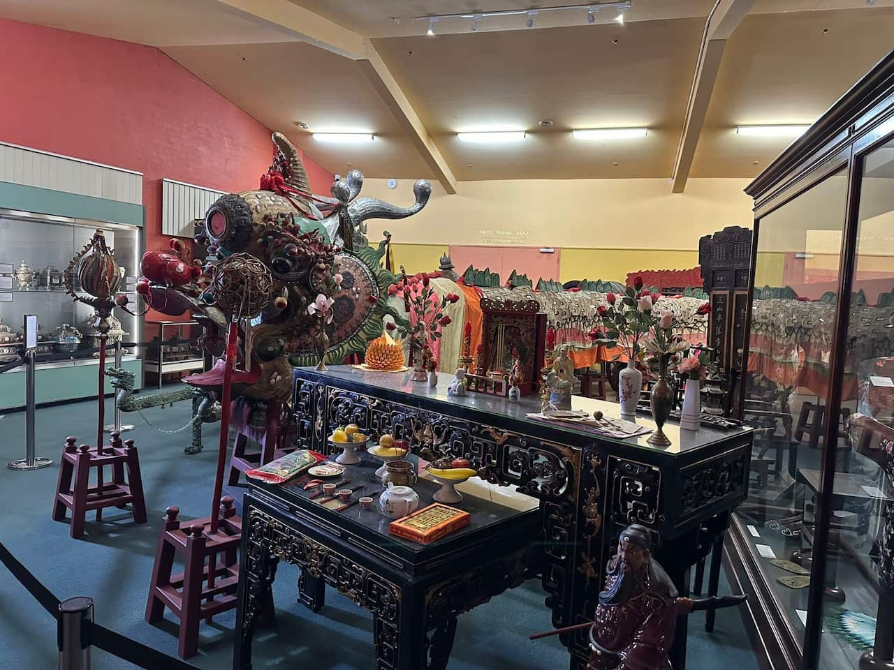 Chinese artifacts including a dresser and processional dragon