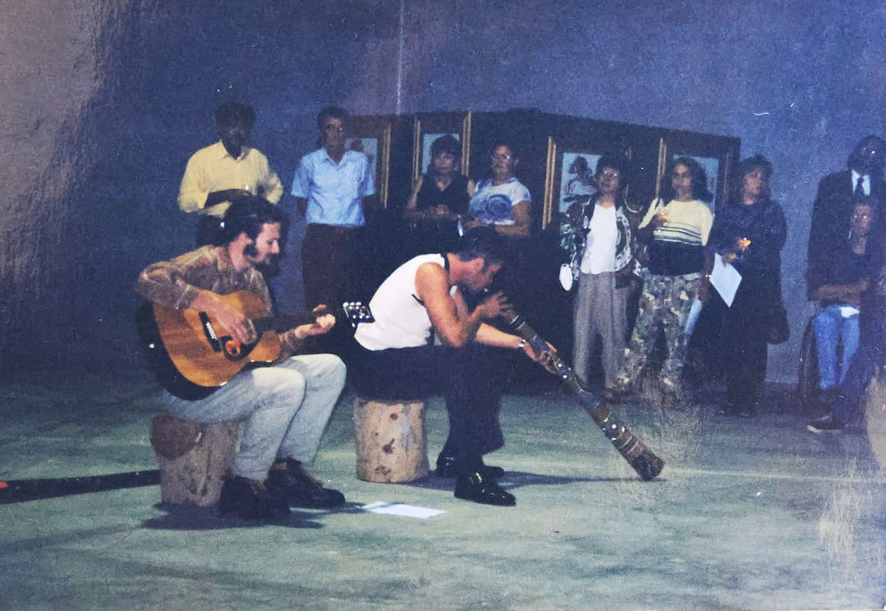 Blak Douglas playing the didgeridoo at first art exhibition titled 'Growing up on Dharug Country'