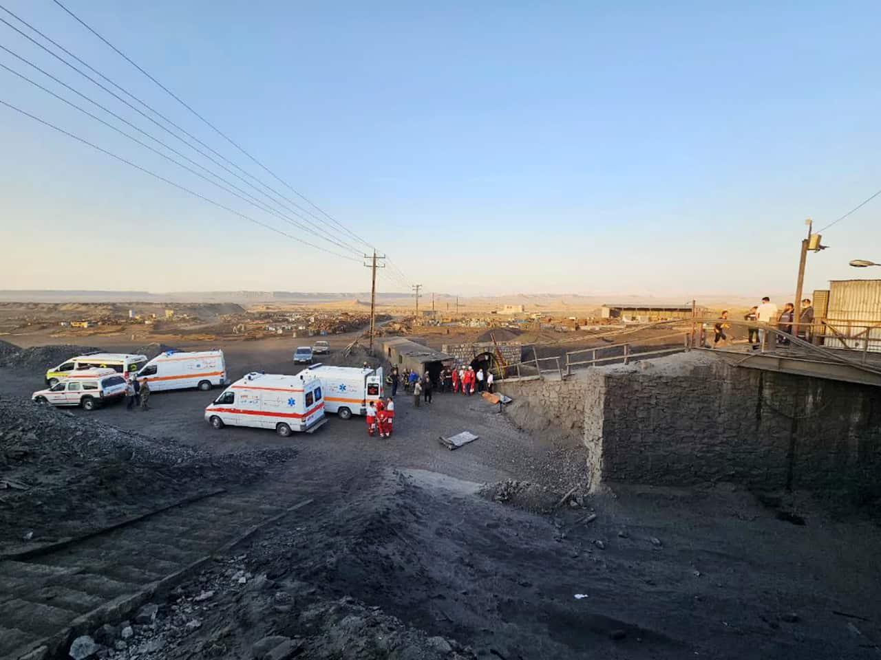 Rescue workers and ambulances at the sit of a coal mine.