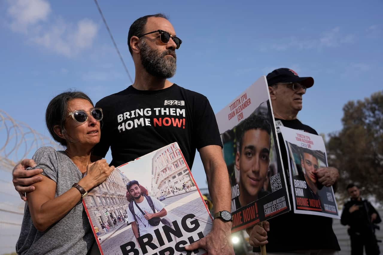 Two people take part in a protest. 