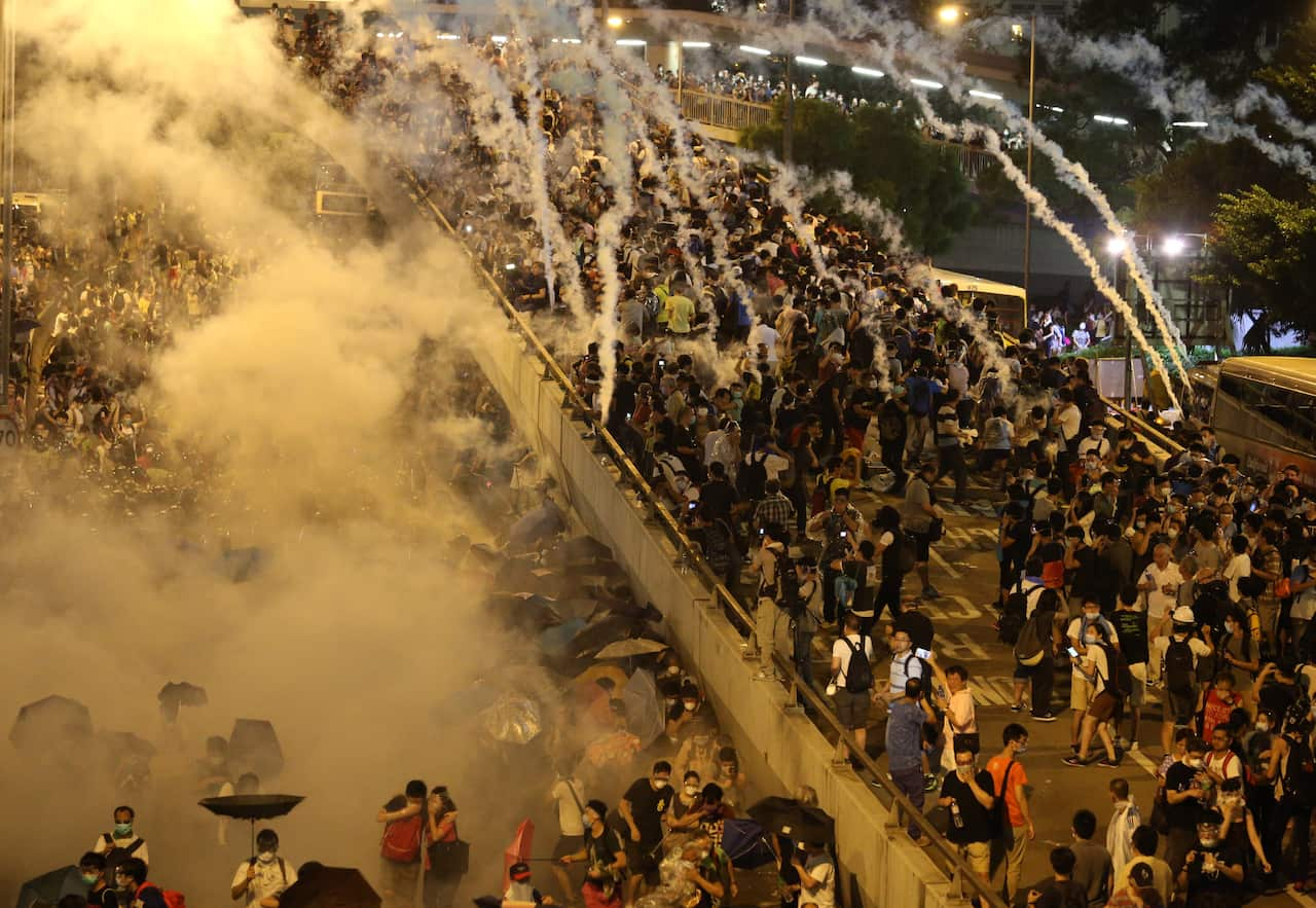 Police fire tear gas on pro-democracy demonstrators in Hong Kong